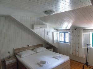 Postel nebo postele na pokoji v ubytování Peric Rooms