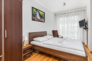 Posteľ alebo postele v izbe v ubytovaní Apartamenty Casa Marina