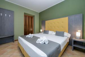 Säng eller sängar i ett rum på Albergo Locanda Primavera