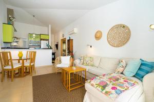 a living room with a couch and a table at Apartament Altea Spaniahome in Altea