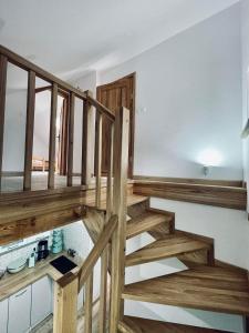 a staircase in a house with wooden steps at Agroturystyka u Beci in Sorkwity