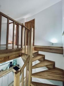 a staircase in a house with wooden steps at Agroturystyka u Beci in Sorkwity +12 photos