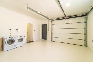 a laundry room with a washer and dryer at Villa Olea in Sveti Petar u Šumi