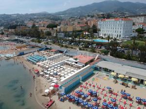 an aerial view of a beach with umbrellas and the water at Colours Apartments & Rooms in Sanremo