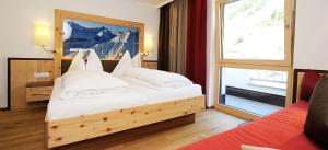 Postel nebo postele na pokoji v ubytování Hotel Kristall B&B