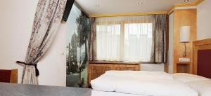 Postel nebo postele na pokoji v ubytování Hotel Kristall B&B
