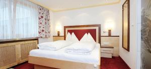 Postel nebo postele na pokoji v ubytování Hotel Kristall B&B
