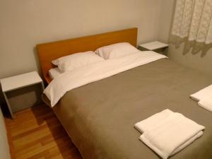 a bed with two white pillows on top of it at 2 bedrooms central area located appartment 1floor in Istanbul