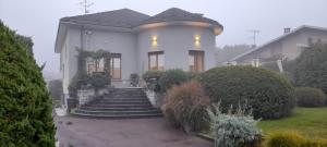 a white house with stairs in the fog at Casa Germana in Invorio Inferiore +28 photos