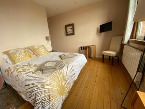 Posteľ alebo postele v izbe v ubytovaní Relais Les Loges-Etretat