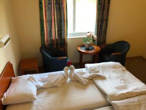 Säng eller sängar i ett rum på Hotell Indalsleden