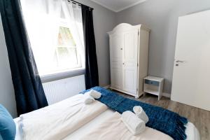Postel nebo postele na pokoji v ubytování Velden Appartements am Wörthersee