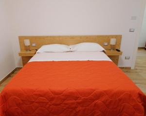 A bed or beds in a room at Nonna Elvira