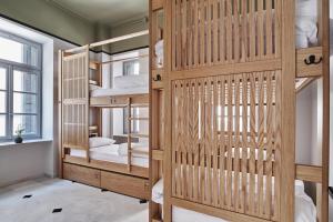 A bed or beds in a room at When in Athens Hostel