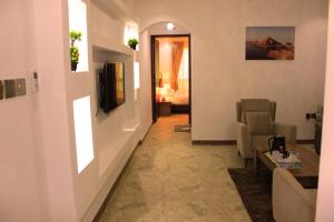 TV a/nebo společenská místnost v ubytování ريلاكس إن للشقق الفندقية Relax Inn Hotel Appartment