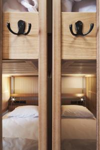 A bed or beds in a room at When in Athens Hostel