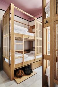 A bed or beds in a room at When in Athens Hostel