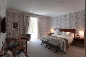 Postel nebo postele na pokoji v ubytování Hotel Villa Soro