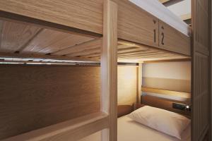 A bed or beds in a room at When in Athens Hostel