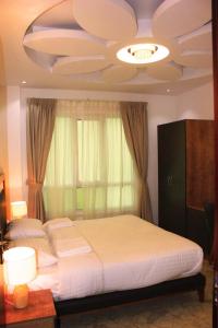 Postel nebo postele na pokoji v ubytování ريلاكس إن للشقق الفندقية Relax Inn Hotel Appartment