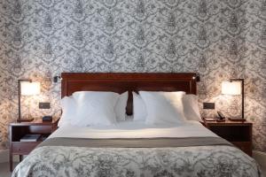 Postel nebo postele na pokoji v ubytování Hotel Villa Soro