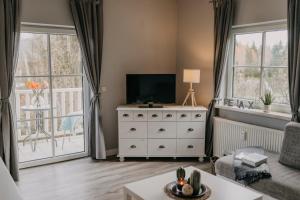TV a/nebo společenská místnost v ubytování Velden Appartements am Wörthersee