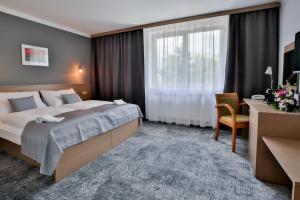 เตียงในห้องที่ LH Parkhotel Hluboka Nad Vltavou