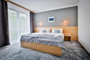 Posteľ alebo postele v izbe v ubytovaní LH Parkhotel Hluboka Nad Vltavou Congress & Wellness