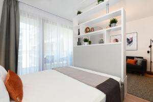 Posteľ alebo postele v izbe v ubytovaní Silver Home Apartments