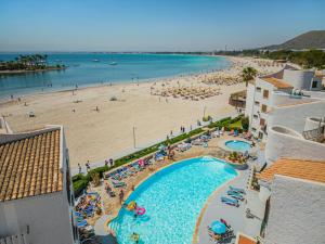 a view of the beach from the balcony of a resort at Apartamento Blue Carabela in Alcudia