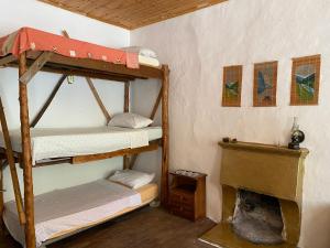 A bed or beds in a room at Shotgun Hostel & Guesthouse