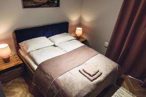 Katil atau katil-katil dalam bilik di Apartamenty Infores Willa Matejki