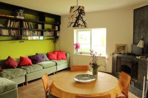 a living room with a table and a couch at Tranquility?JUST RELAX on the NON-TOURISTIC COAST in Colonia de Sant Pere