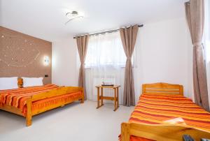 Postel nebo postele na pokoji v ubytování Casa Nikita