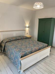 Postel nebo postele na pokoji v ubytování LA CASA DI PIETRA