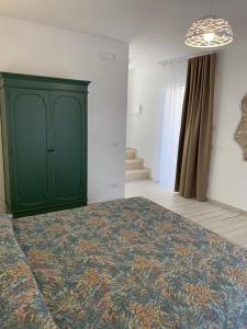 Postel nebo postele na pokoji v ubytování LA CASA DI PIETRA