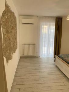 Postel nebo postele na pokoji v ubytování LA CASA DI PIETRA