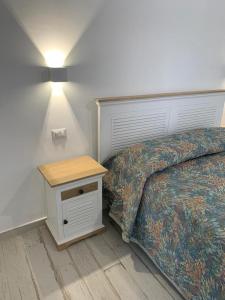 Postel nebo postele na pokoji v ubytování LA CASA DI PIETRA