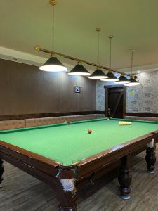 a billiard table in a room with afits at AL BARAKA in Borovoye