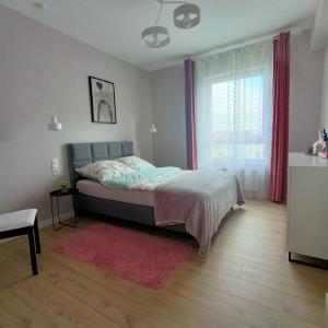 Posteľ alebo postele v izbe v ubytovaní Apartament PERŁA POŁUDNIA