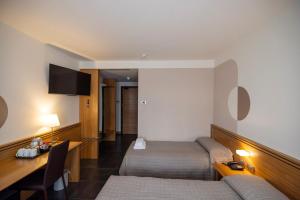 TV a/nebo společenská místnost v ubytování Hotel Europa Belluno