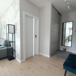 Posteľ alebo postele v izbe v ubytovaní Apartament PERŁA POŁUDNIA