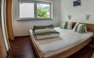 Posteľ alebo postele v izbe v ubytovaní Alpenapart Saphir