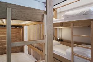 A bed or beds in a room at When in Athens Hostel