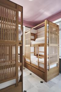 A bed or beds in a room at When in Athens Hostel