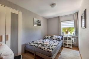 Un pat sau paturi într-o cameră la Ferienhaus Hansen