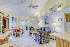 a living room with a couch and a table at Night Heron 35 in Hilton Head Island