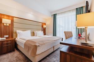 Postel nebo postele na pokoji v ubytování Radsor Hotel