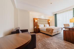 Postel nebo postele na pokoji v ubytování Radsor Hotel
