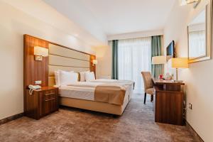 Postel nebo postele na pokoji v ubytování Radsor Hotel